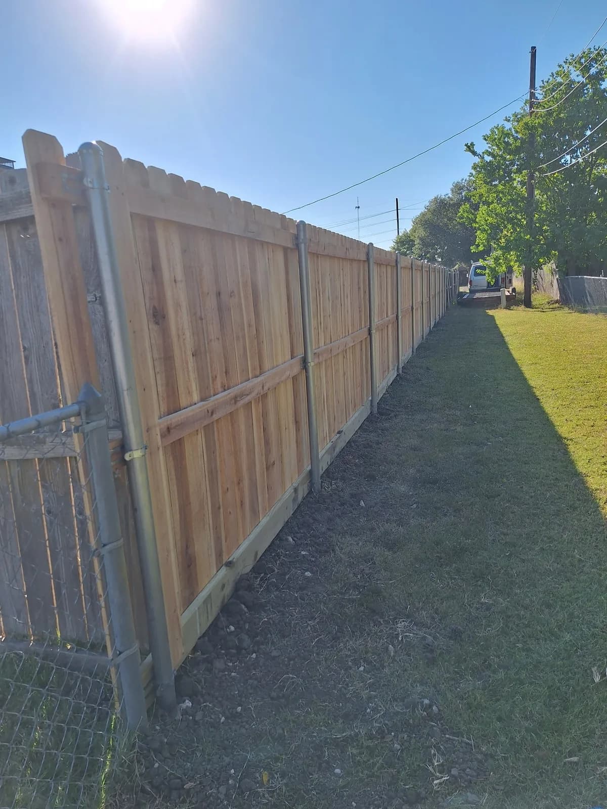 Cedar privacy fence running the length of a side yard.